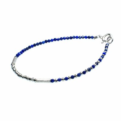 Handmade bracelet with natural, faceted lapis lazuli and pyrite gemstones in a spherical shape and decorative elements made of sterling silver.