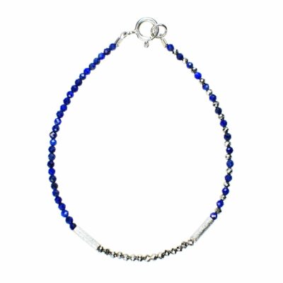 Handmade bracelet with natural, faceted lapis lazuli and pyrite gemstones in a spherical shape and decorative elements made of sterling silver.