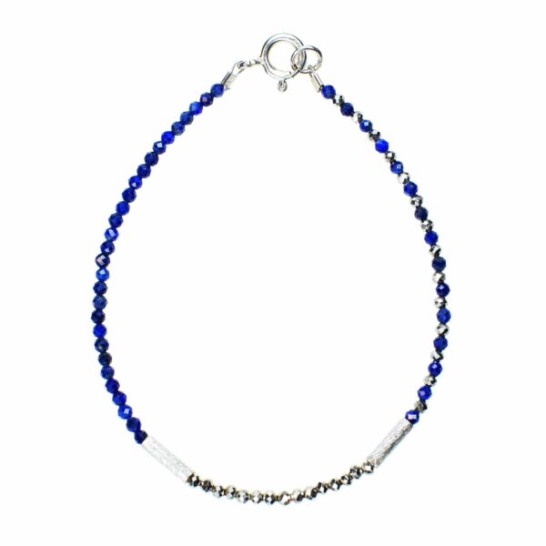 Handmade bracelet with natural, faceted lapis lazuli and pyrite gemstones in a spherical shape and decorative elements made of sterling silver.