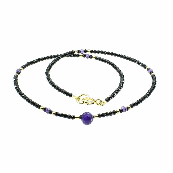 Handmade necklace with natural Spinel and Amethyst gemstones. The necklace is decorated with elements made of gold plated sterling silver and it has an Amethyst drop in the center. Buy online shop.