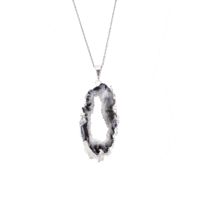 Pendant made of natural agate gemstone with crystal quartz and hypoallergenic silver plated metal. The agate is polished on both sides and the pendant is threaded on a sterling silver chain with adjustable length. Buy online shop.