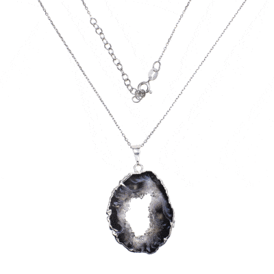 Pendant made of natural agate gemstone with crystal quartz and hypoallergenic silver plated metal. The agate is polished on both sides and the pendant is threaded on a sterling silver chain with adjustable length. Buy online shop.