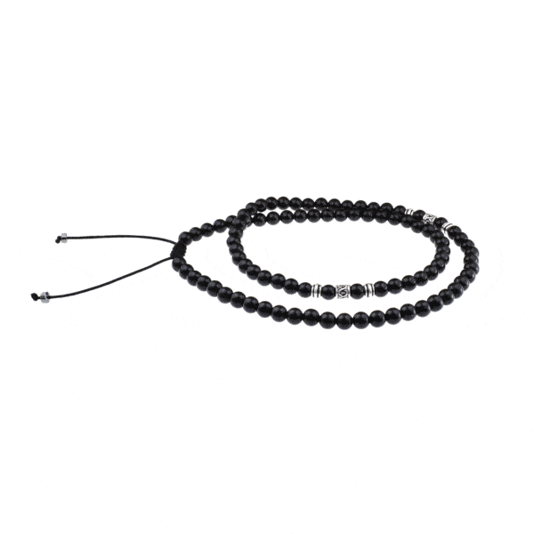 Handmade macrame necklace with natural Onyx gemstones, threaded on a black string. The necklace is decorated with elements made of sterling silver. Buy online shop.