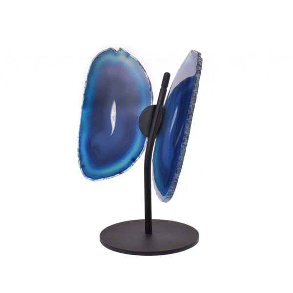 Butterfly with wings made from polished slices of natural blue agate gemstone, placed on a black, metallic base. The butterfly has a size of 17cm.