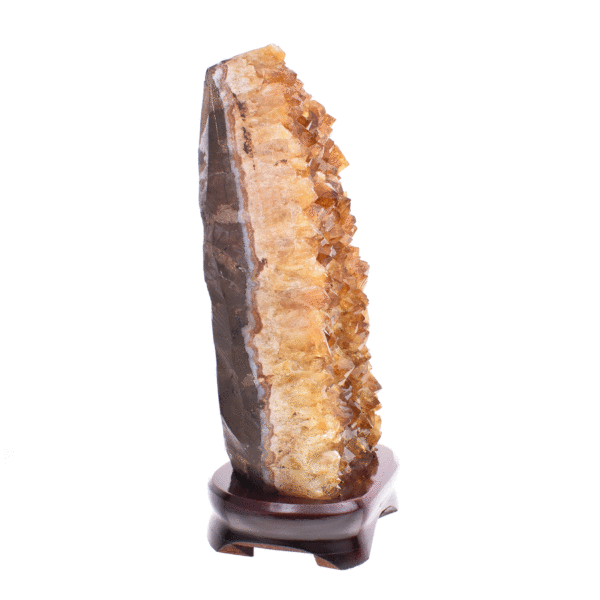 Raw piece of natural citrine quartz gemstone, placed on a wooden base. The stone has a height of 22cm. Buy online shop.