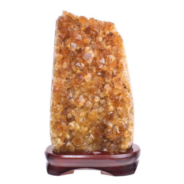 Raw piece of natural citrine quartz gemstone, placed on a wooden base. The stone has a height of 22cm. Buy online shop.