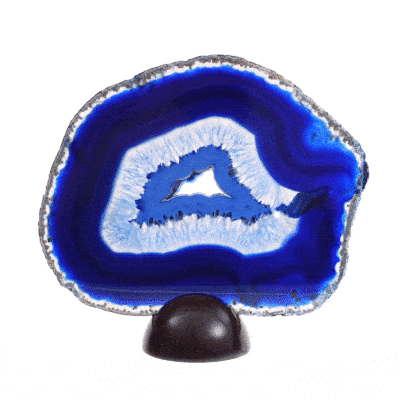 Polished slice of natural agate gemstone with crystal quartz, of blue color. The slice of agate comes with a wooden base and it has a size of 18.5cm. Buy online shop.