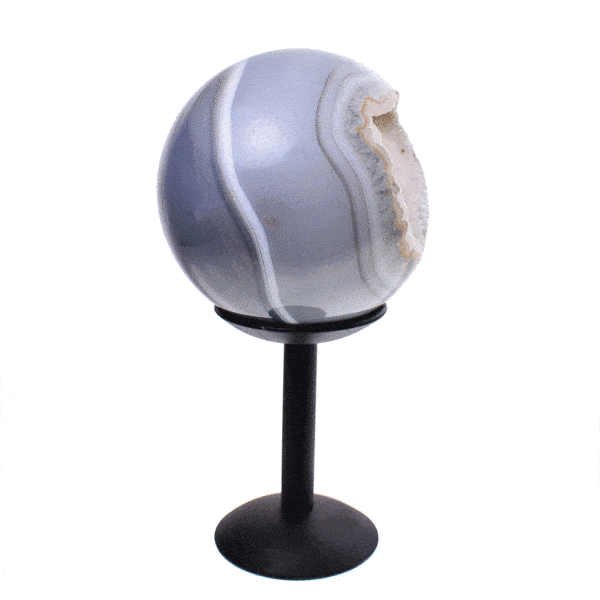 Polished 8.5cm diameter agate sphere gemstone with crystal quartz. The shpere comes with a black, metallic base. Buy online shop.
