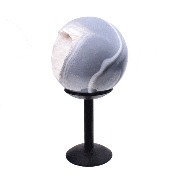 Polished 8.5cm diameter agate sphere gemstone with crystal quartz. The shpere comes with a black, metallic base. Buy online shop.