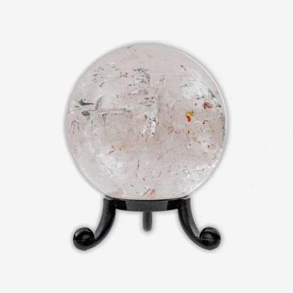 Polished 6cm diameter sphere made from natural crystal quartz. The sphere comes with a black plexiglass base. Buy online shop.