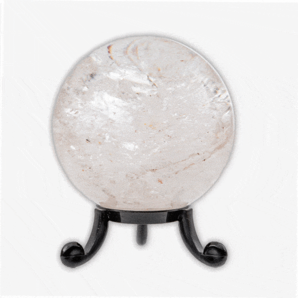 Polished 6cm diameter sphere made from natural crystal quartz. The sphere comes with a black plexiglass base. Buy online shop.