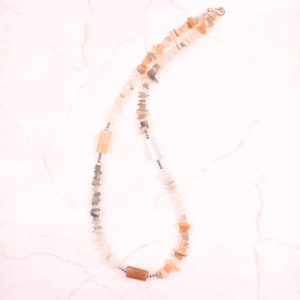 Handmade necklace made of natural, multi colored moonstone and hematite gemstones, in different shapes. The necklace has a sterling silver clasp.