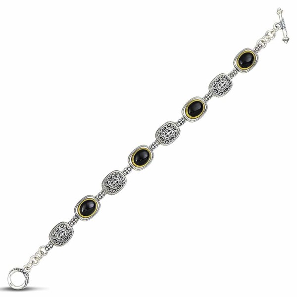 Handmade bracelet made of sterling silver with gold plated details and black onyx stones, in oval shape. Buy online shop.