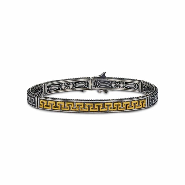Handmade Greca bracelet made of sterling silver with gold plated details. The ancient Greek symbol of Meander is designed on the bracelet. Buy online shop.