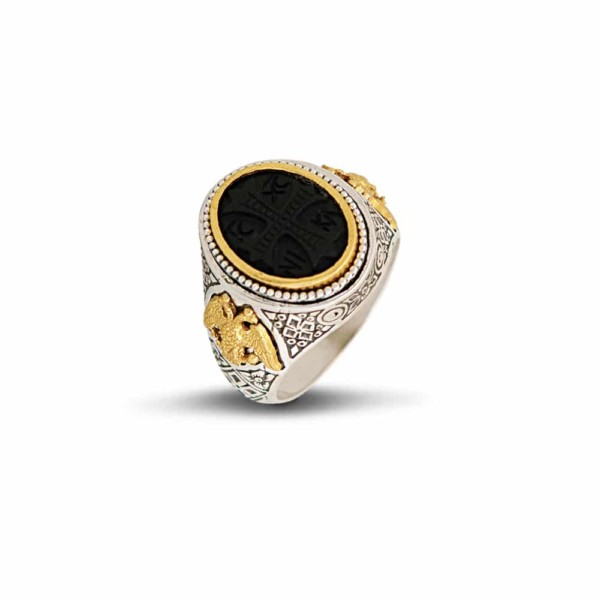 Handmade Byzantine style ring made of sterling silver with gold plated details. The band of the ring has two gold plated eagles and a black cross is carved in the center of the ring. Buy online shop.