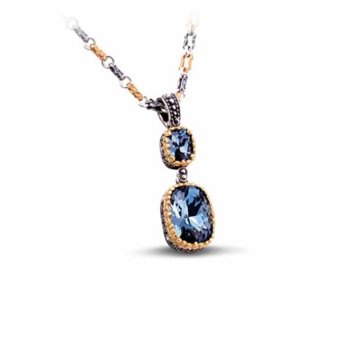 Handmade pendant made of sterling silver with gold plated details and blue crystals. The pendant is threaded on a tricolor chain. Buy online shop.