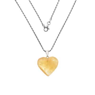 Pendant made from natural citrine quartz gemstone, in the heart shape. The pendant is threaded on a sterling silver chain. Buy online shop.