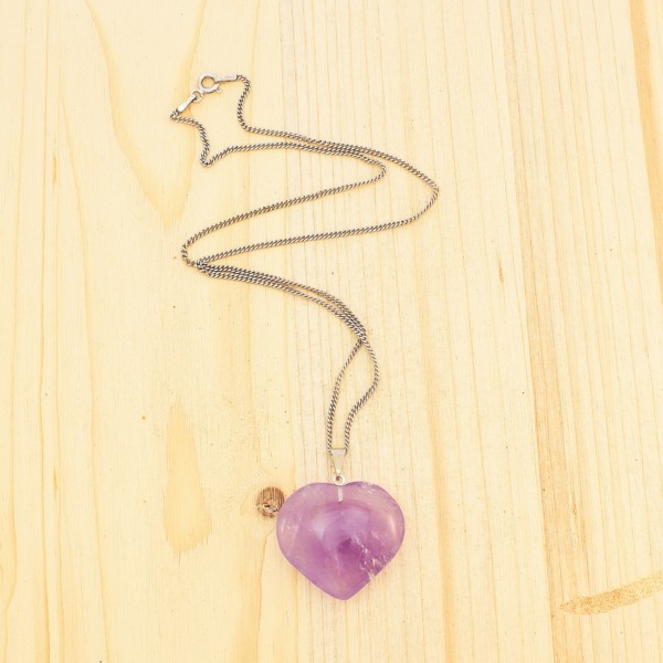 Pendant made of Amethyst, in the shape of heart, threaded on a thin chain made of sterling silver. Buy online shop.