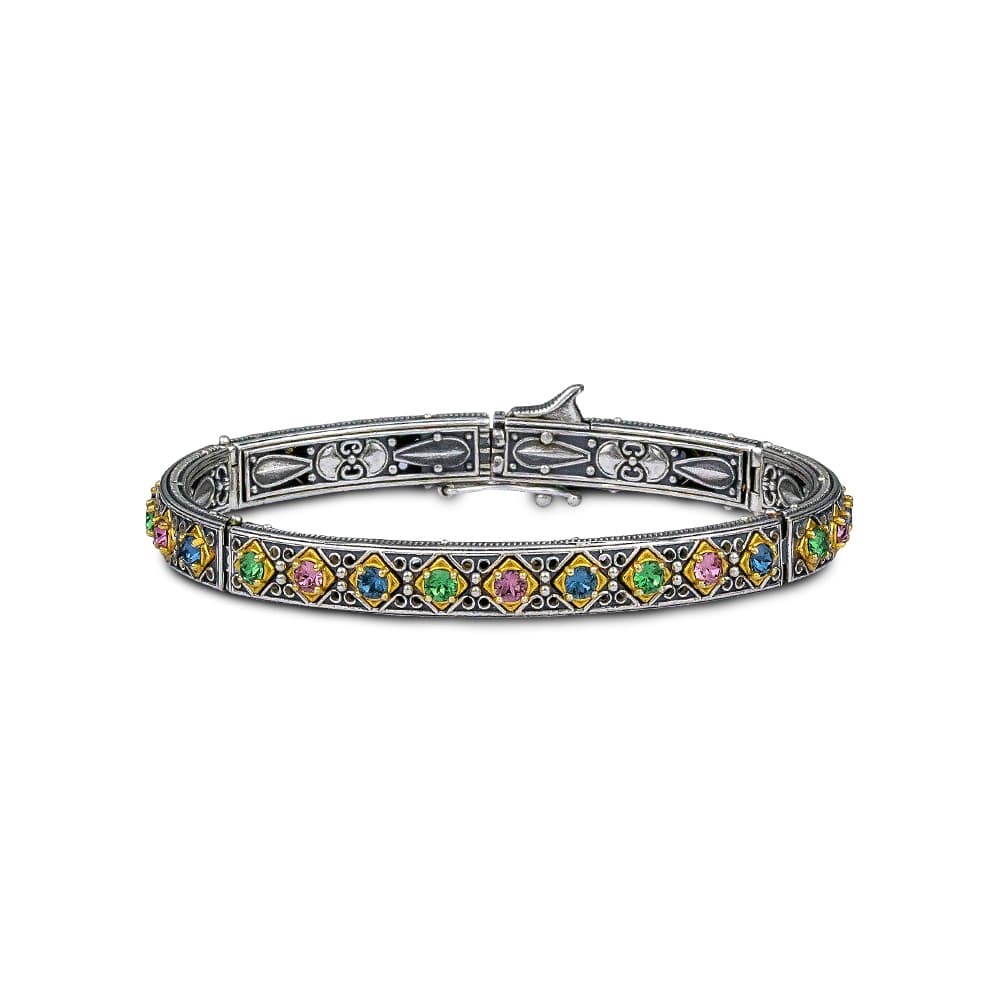 Handmade bracelet made of sterling silver with gold plated details and multicolor crystals. Buy online shop.