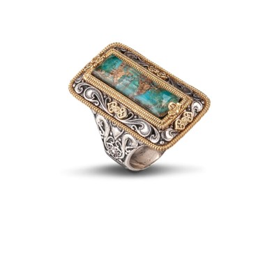 Handmade ring made of sterling silver with gold plated details and turquoise gemstone in parallelogram shape. Buy online shop.