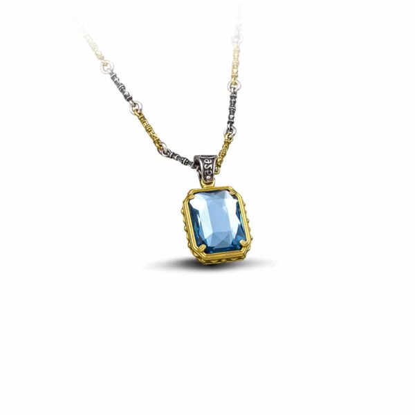 Handmade reversible pendant made of sterling silver with gold plated details and crystals. The pendant is threaded on a sterling silver tricolor chain. Buy online shop.