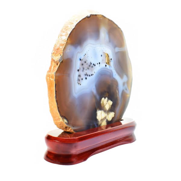 Slice of natural Agate gemstone with crystal quartz, placed on a wooden base. The Agate is polished on both sides and it has a height of 21cm. Buy online shop.