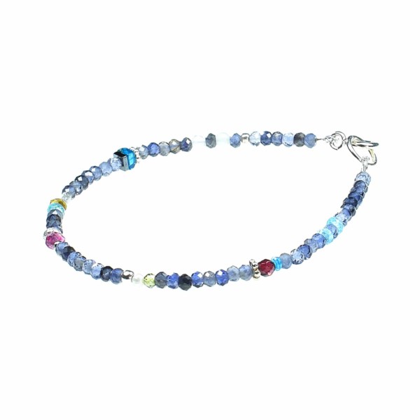 Handmade bracelet made of Iolite and other semi-precious stones. The bracelet is decorated with sterling silver elements. Buy online shop.