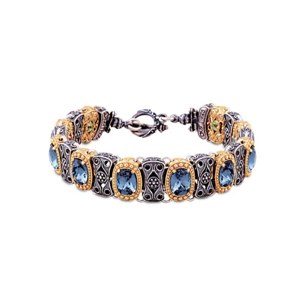 Handmade reversible bracelet made of sterling silver with gold plated details, blue crystals and semi-precious stones. Buy online shop.