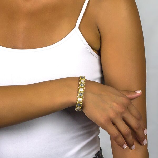 Handmade reversible bracelet made of sterling silver with gold plated details and crystals. Buy online shop.