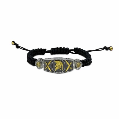 Handmade cord bracelet of ancient Greek style, made of sterling silver with gold plated details and a gold plated helmet, as a central element.
