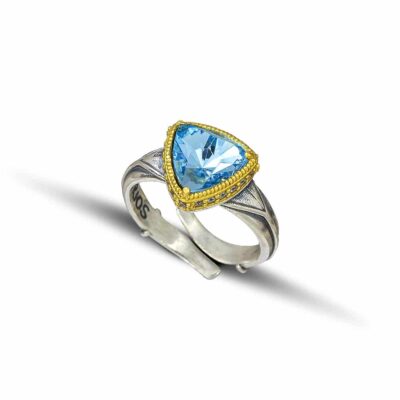 Handmade ring made of sterling silver with gold plated details and blue crystal. Buy online shop.