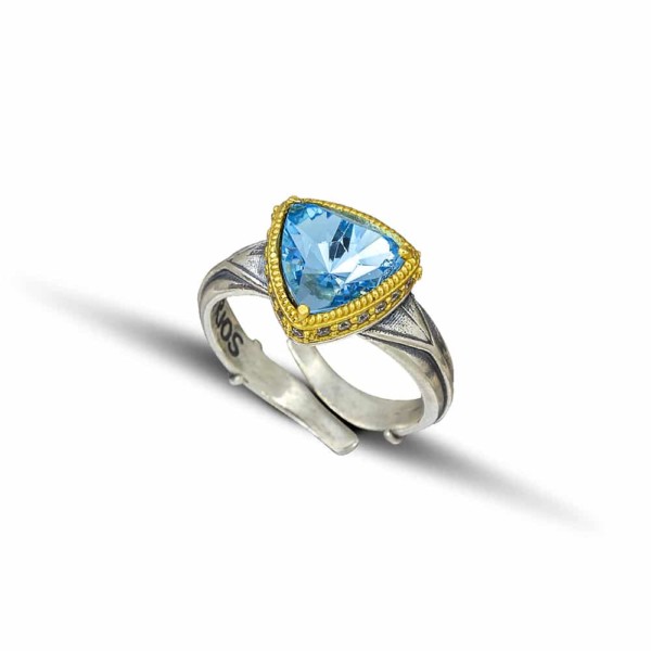 Handmade ring made of sterling silver with gold plated details and blue crystal. Buy online shop.