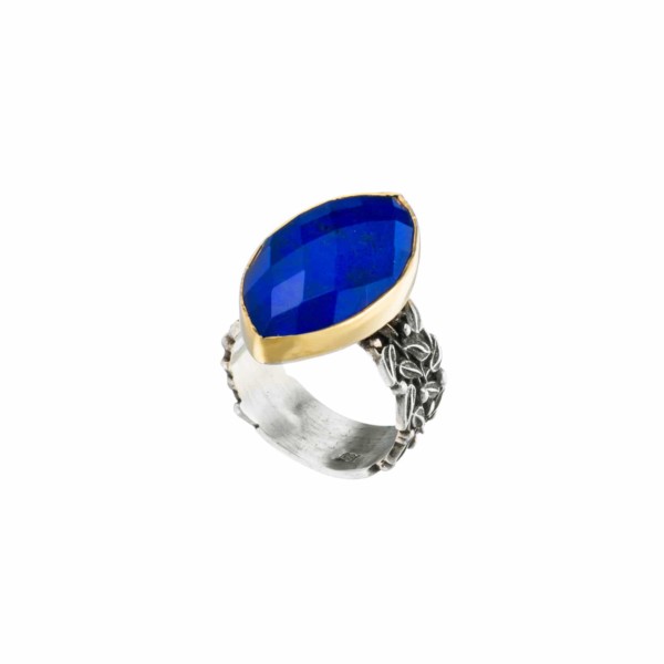 Handmade sterling silver and gold ring with doublet made of crystal quartz and lapis lazuli. The band of the ring is made of sterling silver and the outline of the bezel is made of 18 carats gold. The doublet consists of two layers of stones. The upper stone is crystal quartz and the stone at the bottom is lapis lazuli. Buy online shop.