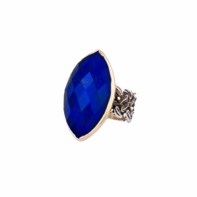 Handmade sterling silver and gold ring with doublet made of crystal quartz and lapis lazuli. The band of the ring is made of sterling silver and the outline of the bezel is made of 18 carats gold. The doublet consists of two layers of stones. The upper stone is crystal quartz and the stone at the bottom is lapis lazuli. Buy online shop.