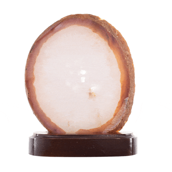 Slice of natural Agate gemstone with crystal quartz, placed on a wooden base. The Agate is polished on the front side and it has a height of 14cm. Buy online shop.