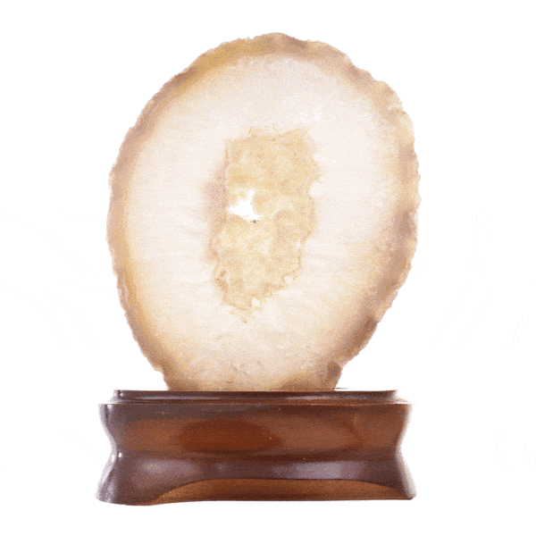 Slice of natural Agate gemstone with crystal quartz, placed on a wooden base. The Agate is polished on one side and it has a height of 15cm. Buy online shop.