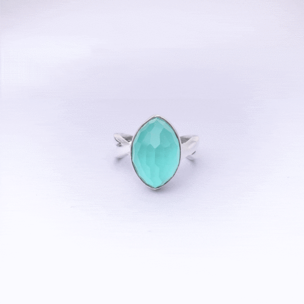 Handmade sterling silver ring with doublet made of natural chalcedony and crystal quartz gemstones, in a marquise shape. The doublet consists of two layers of stones.The upper stone is crystal quartz and the stone at the bottom is chalcedony. Buy online shop.