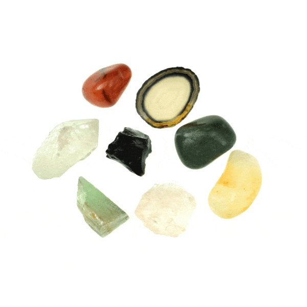 Natural gemstone collection, which includes raw Obsidian, crystal Quartz, pink Quartz and green Calsite pieces and polished Aventurine, Citrine, Agate and Carnelian pieces. Buy online shop.