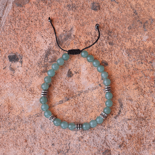 Handmade macrame bracelet with natural Aventurine and Hematite gemstones, threaded on a black string. The bracelet is decorated with elements made of sterling silver. Buy online shop.