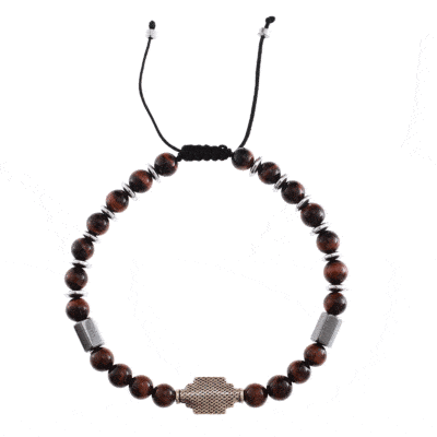 Handmade macrame bracelet with natural red Tiger Eye and Hematite gemstones, threaded on a black string. The bracelet has a decorative sterling silver element on the center. Buy online shop.