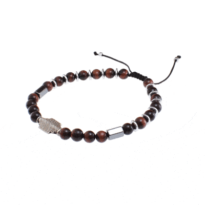 Handmade macrame bracelet with natural red Tiger Eye and Hematite gemstones, threaded on a black string. The bracelet has a decorative sterling silver element on the center. Buy online shop.