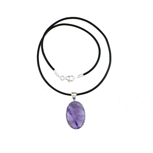 Handmade pendant made of sterling silver and raw Amethyst gemstone, in an oval shape. The pendant is threaded on a black leather, which has sterling silver clasp. Buy online shop.