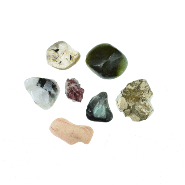 Natural gemstone collection, which includes raw pyrite and pink tourmaline pieces and polished jade, emerald, white labradorite with black tourmaline, pink opal and rutilated crystal quartz pieces. Buy online shop.