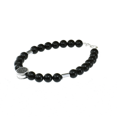 Handmade bracelet with natural black tourmaline and hematite gemstones. The bracelet has a central element and clasp made of sterling silver. Buy online shop.