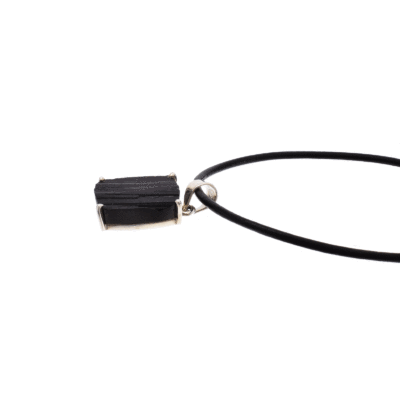 Handmade pendant made of sterling silver and natural black tourmaline gemstone, in a parallelogram shape. The pendant is threaded on a black leather with sterling silver clasp. Buy online shop.