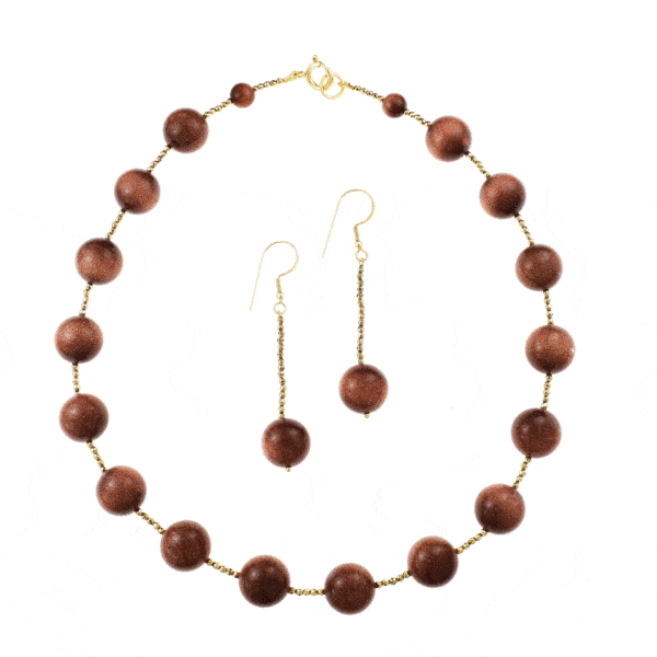 Handmade necklace and earrings set with Goldstone, Pyrite and details made of gold plated sterling silver. Buy online shop.
