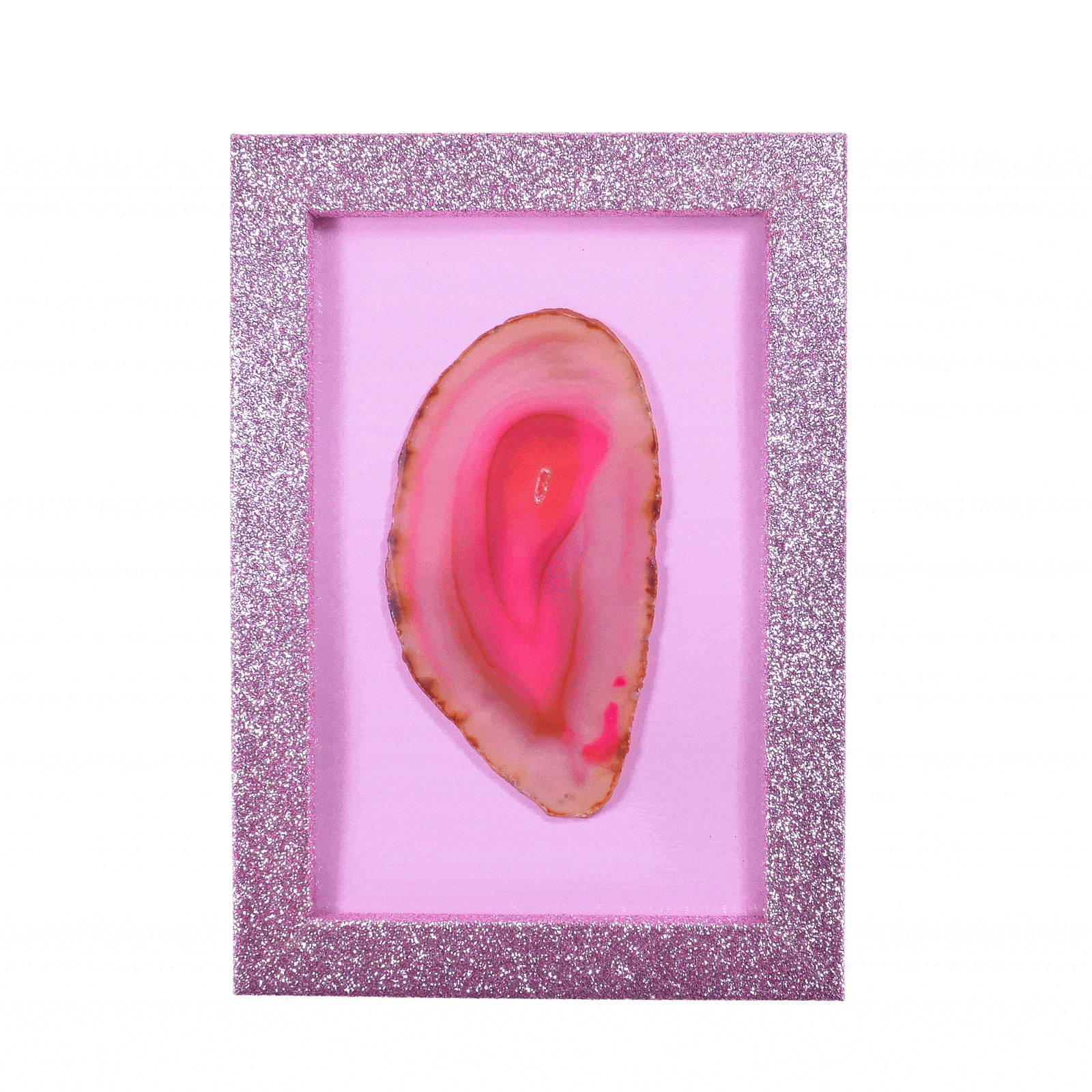 Κορνίζα με ροζ γκλίτερ, η οποία εμπεριέχει μια φέτα φυσικής πέτρας Αχάτη ροζ χρώματος. Αγοράστε online shop.