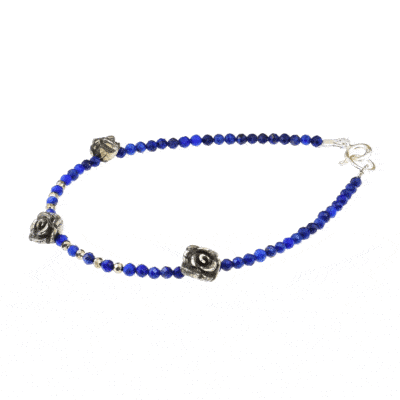 Handmade bracelet with Lapis Lazuli and Pyrite gemstones and decorative flowers made of Pyrite. The bracelet has a sterling silver clasp. Buy online shop.