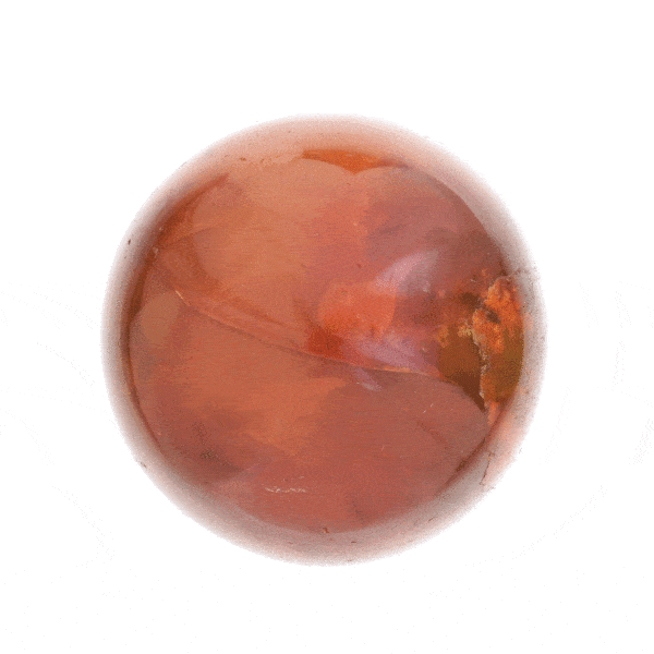 Sphere made of natural Carnelian gemstone, with a diameter of 6.5cm. The sphere is placed on a silicon base. Buy online shop.