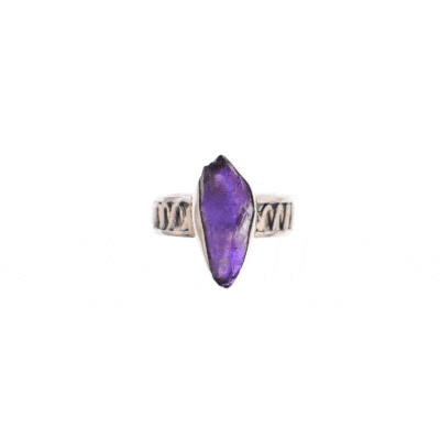 *Handmade ring made of sterling silver and natural raw Amethyst gemstone of irregular shape. The band of the ring is decorated with beautiful perforated designs.